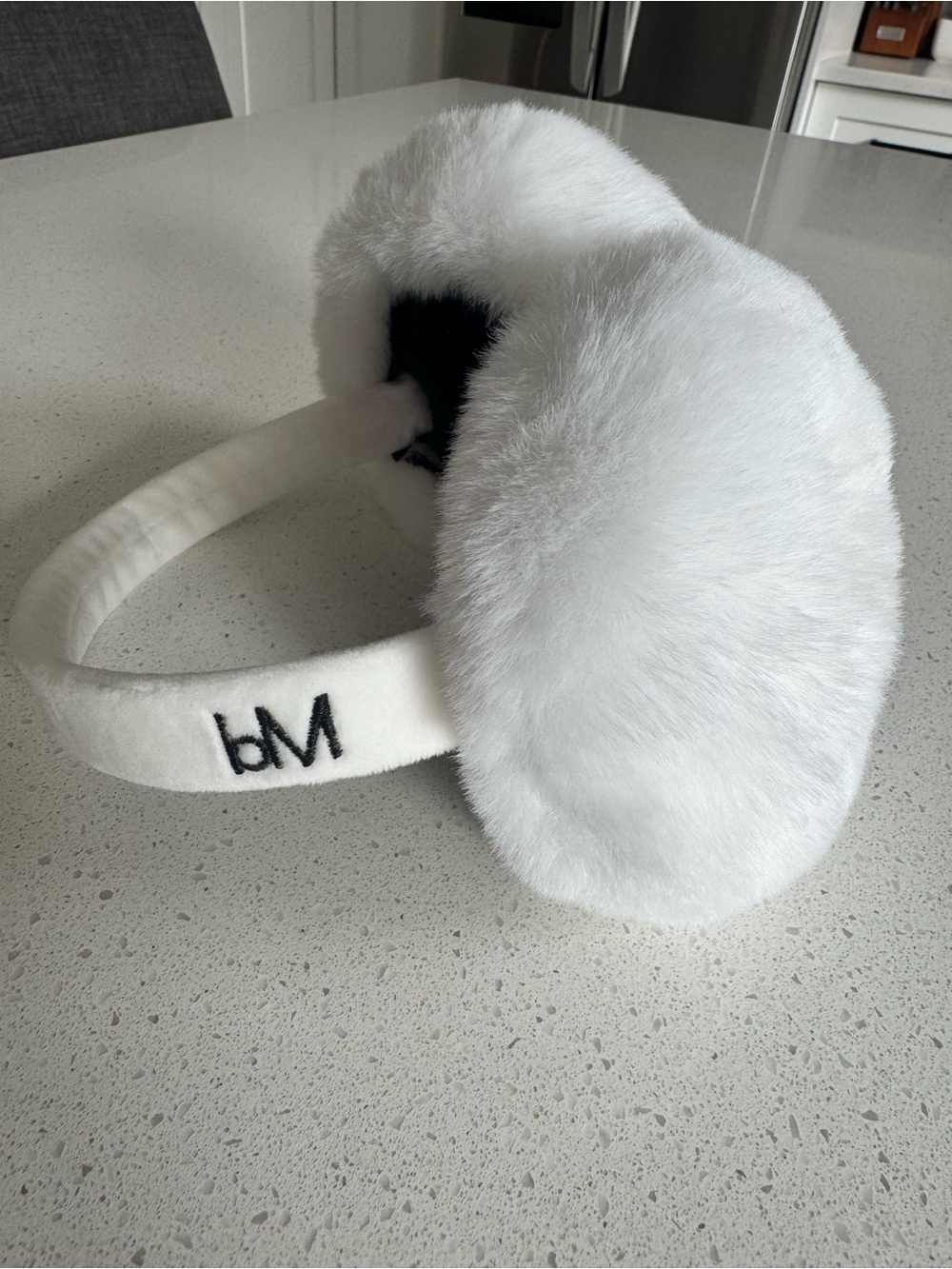 bareMinerals White Faux Fur Earmuffs with Black Logo